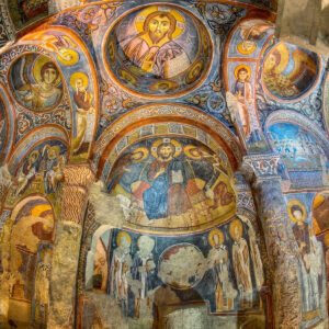 Carved archways and religious murals inside Goreme Open-Air Museum, Turkey