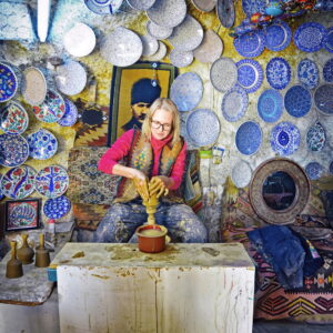 Tourist shaping clay at a pottery studio in Avanos