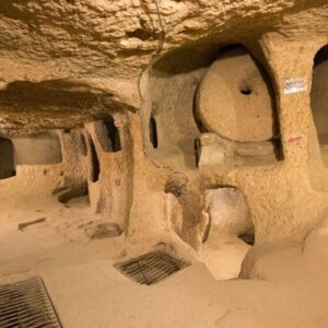Tourist exploring the tunnels of Kaymaklı Underground City