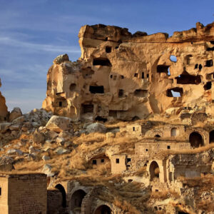 Cavusin’s rock fortress standing against Cappadocia’s dramatic landscape