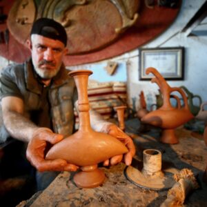Master potter working on a ceramic piece in Avanos