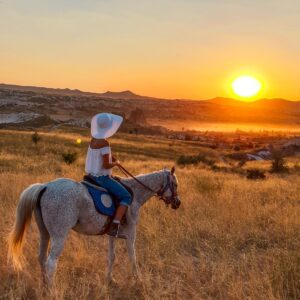 Horseback rider exploring Cappadocia’s unique rock formations and scenic trails