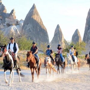 Rider on a majestic horse exploring the red and rose valleys of Cappadocia