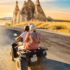 Cappadocia ATV tour at sunset, riding through rugged landscapes and rock formations