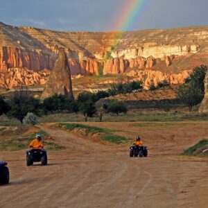 Adventurers riding ATVs on rugged trails in Cappadocia’s unique landscape