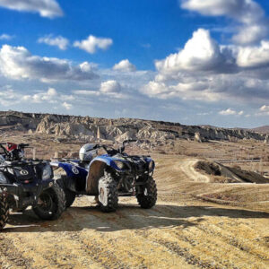 Group of travelers on a guided 1-hour ATV ride through Cappadocia’s valleys