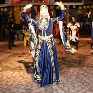 Dancers performing an energetic Turkish folk dance at a Cappadocia night event