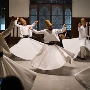 Close-up of a Whirling Dervish in deep meditation, eyes closed, arms extended, embracing the divine energy during a Sema ceremony.