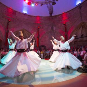 The stunning setting of a Whirling Dervish Show in Cappadocia, where ancient traditions meet breathtaking landscapes
