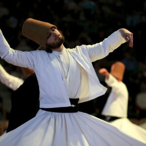 Sacred Sema ritual in Cappadocia A group of Whirling Dervishes in flowing white garments performing a spiritual dance