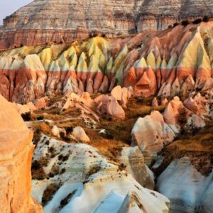 Dramatic cliffs and fairy chimneys in Red Valley at golden hour