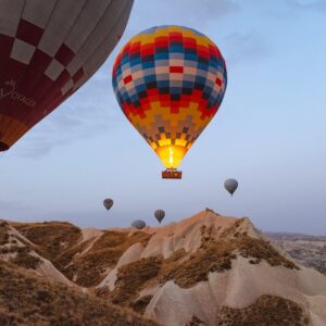 Hot air balloons floating over Cappadocia’s fairy chimneys