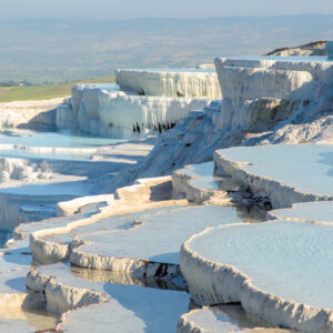 Walk the white travertine terraces of Pamukkale