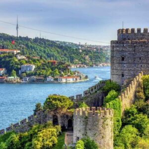 The silhouette of Rumeli Fortress standing proudly above the waters